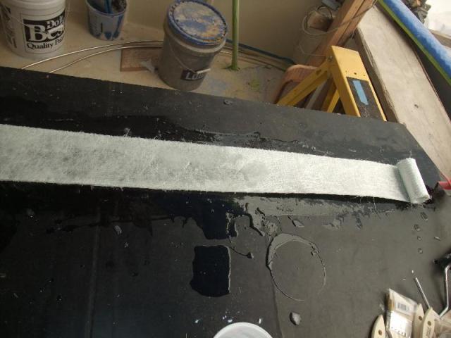Wetting out the fiberglass mat